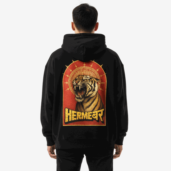 Man wearing black Divine Roar Hoodie by Hermeburr with roaring tiger and golden halo graphic on back