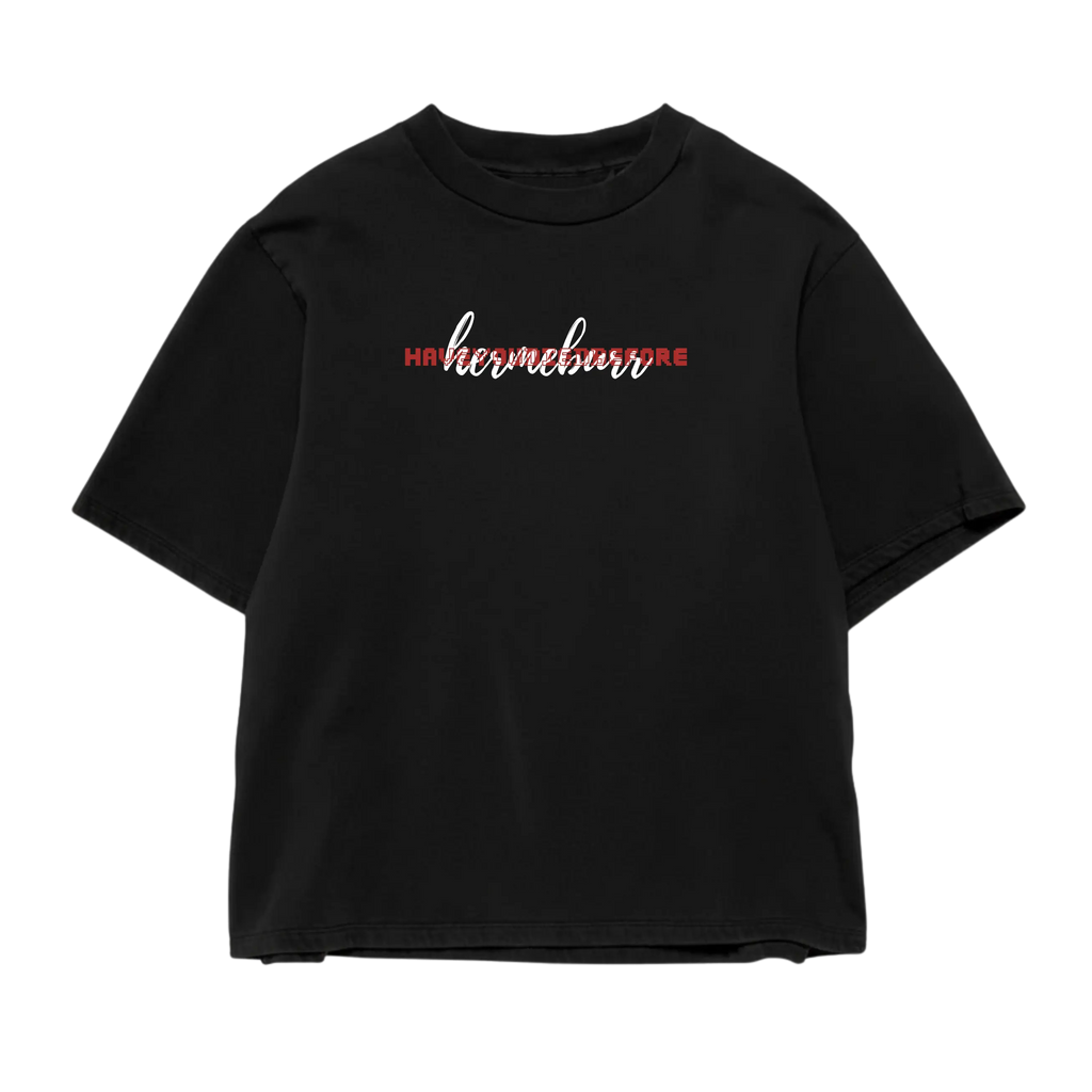 Male model wearing black oversized “Take Risk and Build” Hermeburr T-shirt, front view, minimal chest logo, premium 240 GSM cotton.